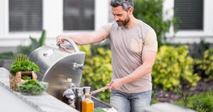 man at grill
