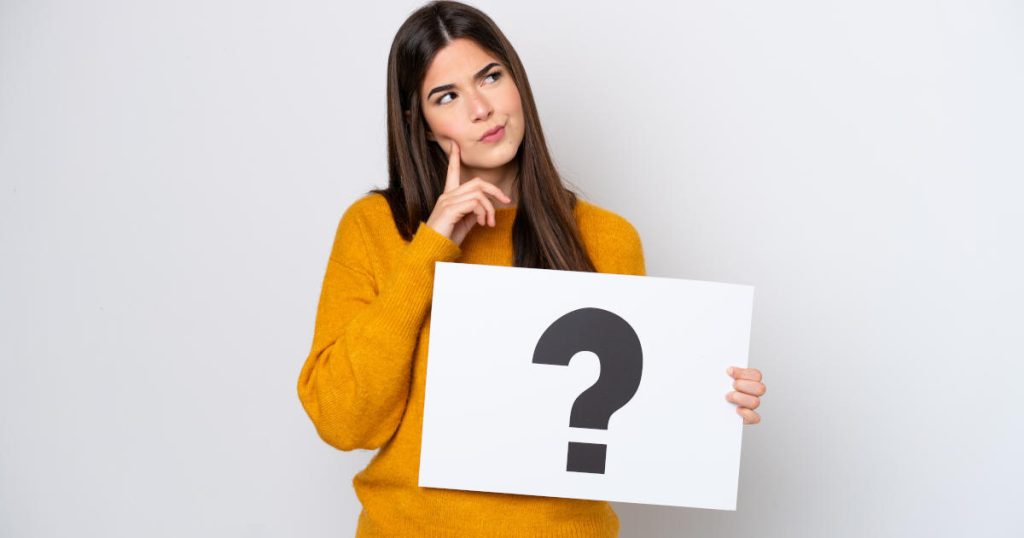 woman with question mark sign